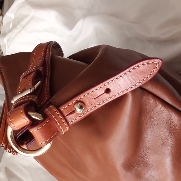 Dooney & Bourke Smooth Genuine Leather    Handbag. Color is a  Rich Caramel. - Picture 11 of 16
